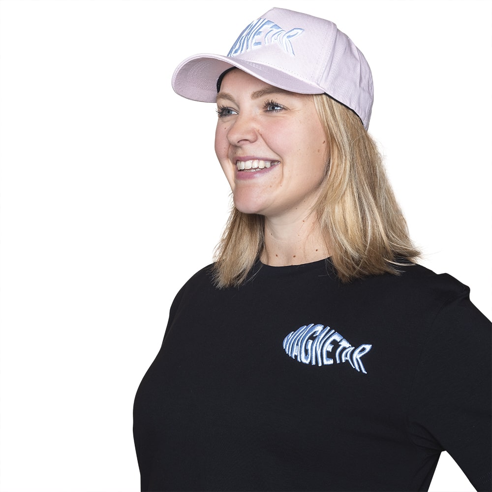 The baseball cap for women is pink with a white print