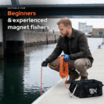 Lifestyle image of Hardcore fishing magnet used from a dock, suitable for beginners and experienced magnet fishers, with recovery rope and grappling hook.