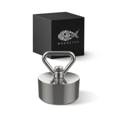 Product photo of Hardcore fishing magnet with stainless steel eyebolt and protective housing, displayed with branded storage box for magnet fishing and metal recovery.