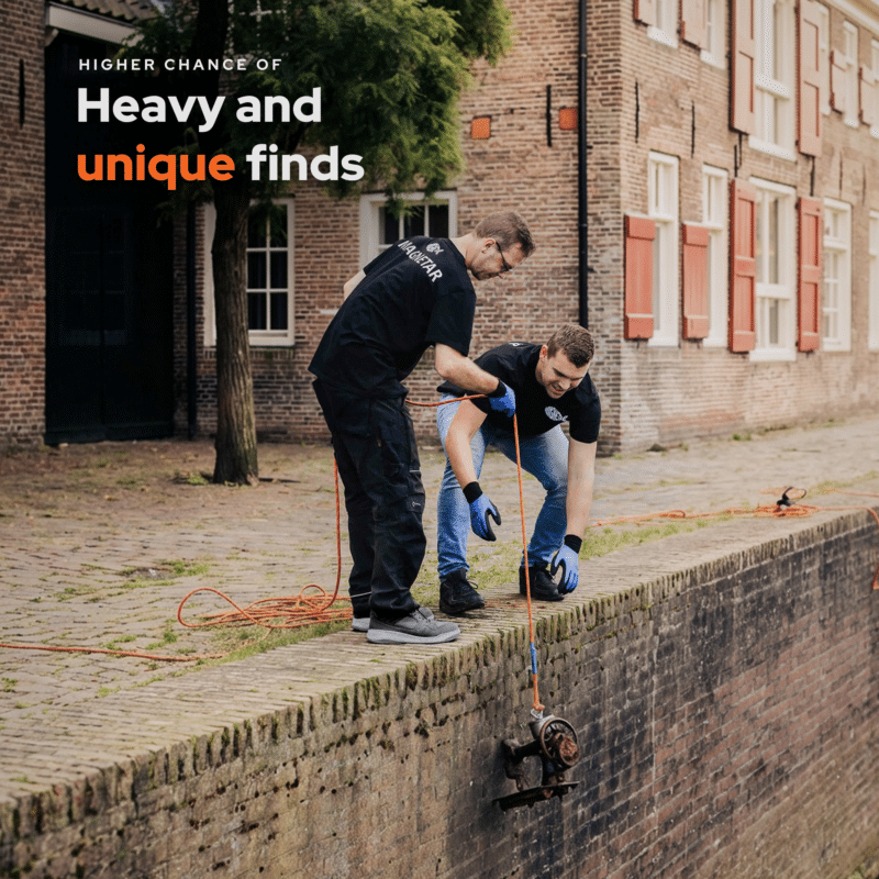 Lifestyle image of magnet fishing in a canal, recovering a heavy metal object with a Beast 360° fishing magnet for larger and unique underwater finds.