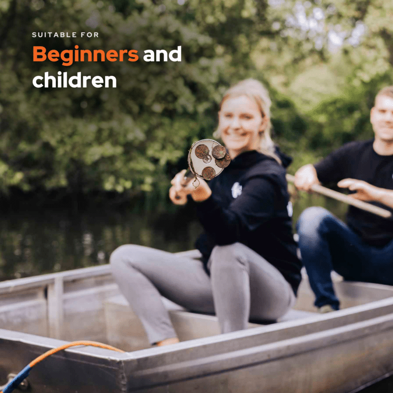 Lifestyle image of beginners magnet fishing from a boat, showing a lightweight Easy neodymium magnet on a pole with collected metal finds, suitable for families and children outdoors